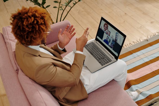 An adult man in a group online therapy video call.